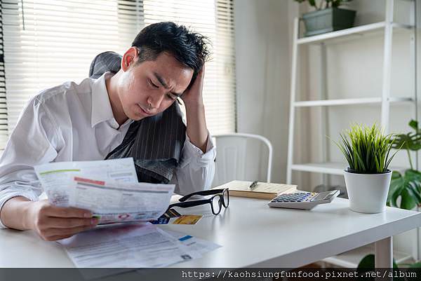 stressed-young-asian-businessman-holding-so-many-expenses-bills-such-as-electricity-bill-water-bill-internet-bill-cell-phone-bill-credit-card-bill-his-hand-no-money-pay-debt.jpg